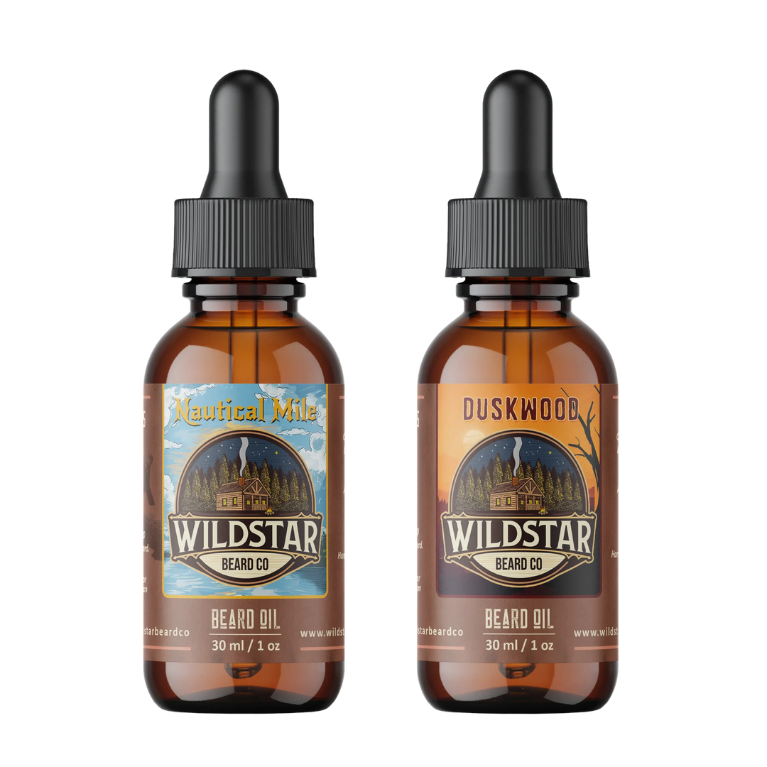 Two bottles of Wildstar Beard Co. beard oil with different scents on a white background
